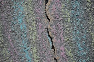 Photo treatment of paint cracks